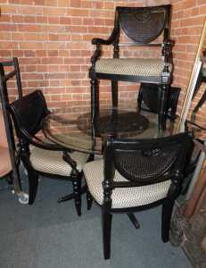 A dining suite, comprising a set of four ebonised dining chairs, two carvers, and two singles,...