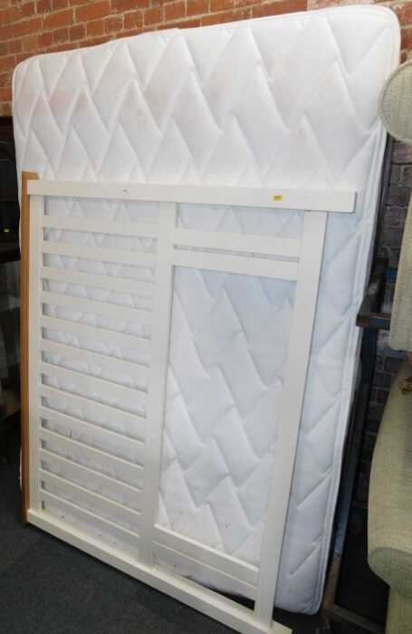 A double divan, with split base, headboard, and mattress.