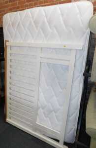 A double divan, with split base, headboard, and mattress.