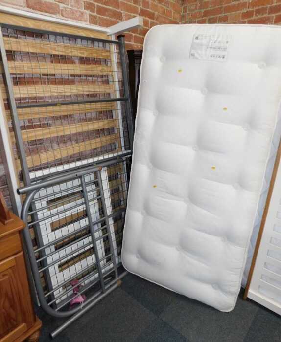 A wooden framed single bed, with a Hypnoss Cotton Original 7 mattress, together with a metal...