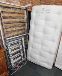 A wooden framed single bed, with a Hypnoss Cotton Original 7 mattress, together with a metal...