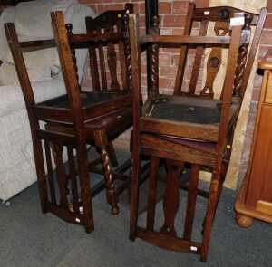 A set of four oak early 20thC dining chairs, with barley twist legs and H stretchers below.