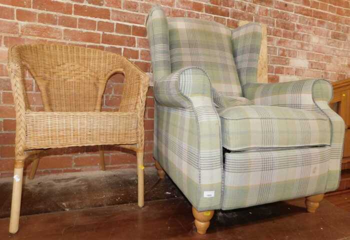 A chequered finished reclining wingback armchair, and a wicker and bamboo conservatory tub chair....