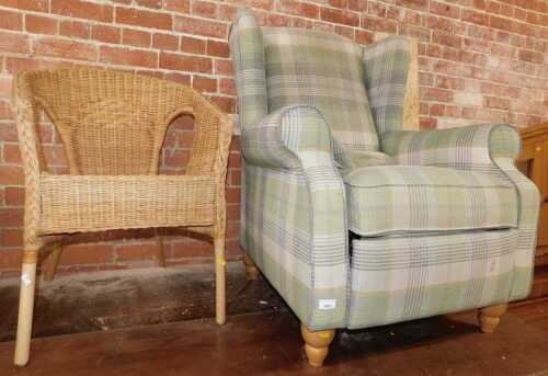 A chequered finished reclining wingback armchair, and a wicker and bamboo conservatory tub chair....
