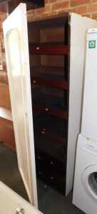 A section of a Victorian mahogany wardrobe, enclosing two drawers below four slides, later...