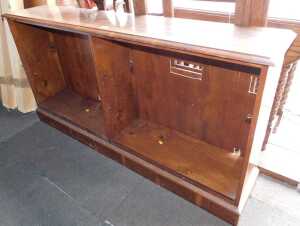 A yew veneered two section open bookcase.