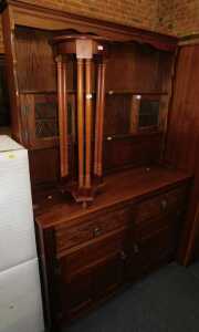 An oak finished dresser with plate rack and two glazed doors, over base unit of two drawers over...