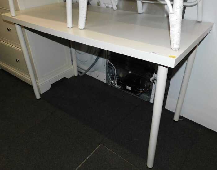 An Ikea Linnmon Adils white work table, with removable legs.