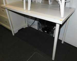An Ikea Linnmon Adils white work table, with removable legs.
