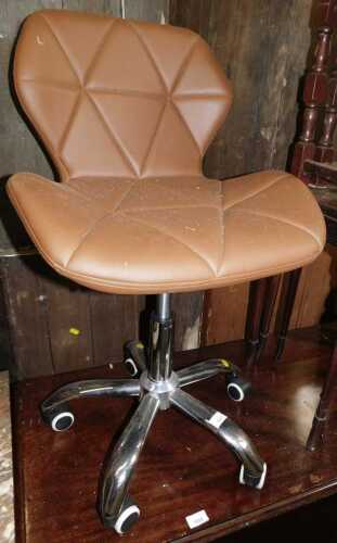 A brown faux leather office chair.