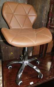 A brown faux leather office chair.