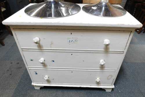 A white painted pine three-drawer chest, raised on bracket feet. (AF)