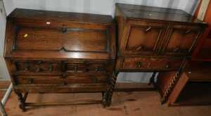 An oak cocktail cabinet with lift lid over two folding doors over single drawer, raised on...