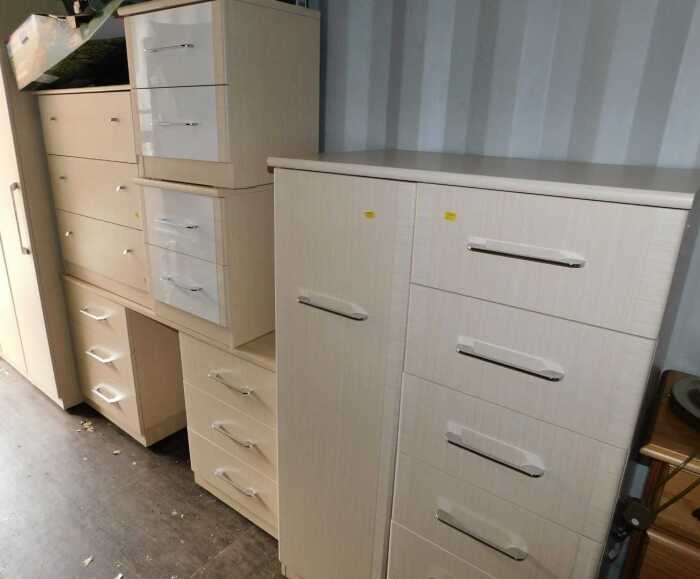 A bedroom suite, comprising a chest of drawers, with three long drawers, two small chests, of...