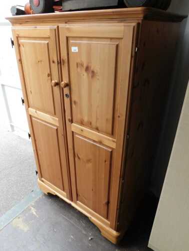 A Ducal pine two door Envoy workstation, with sliding surfaces for PC or laptop and open...