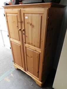 A Ducal pine two door Envoy workstation, with sliding surfaces for PC or laptop and open...