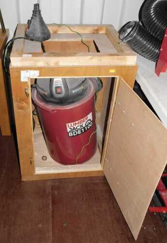 A wooden crate containing a Lumberjack BDE1100 industrial vacuum cleaner.