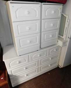 A four-piece bedroom suite, comprising a pair of three drawer bedside chests, a chest of three...