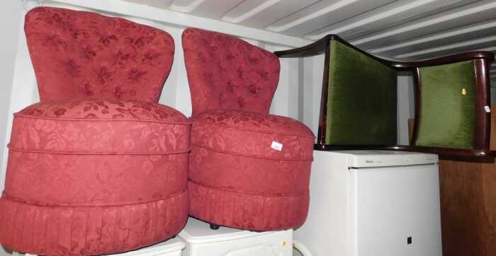 A pair of red upholstered tub nursing chairs, and a single dining chair, Regency style, raised...
