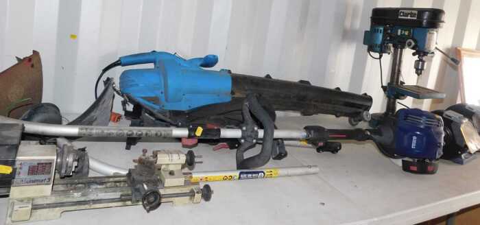 Tools, comprising an Emco Unimat 3 electric lathe, petrol strimmer, various parts, a grinder,...