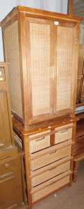 A two door pine and caned unit, two doors opening to reveal shelves to interior, and a pine...