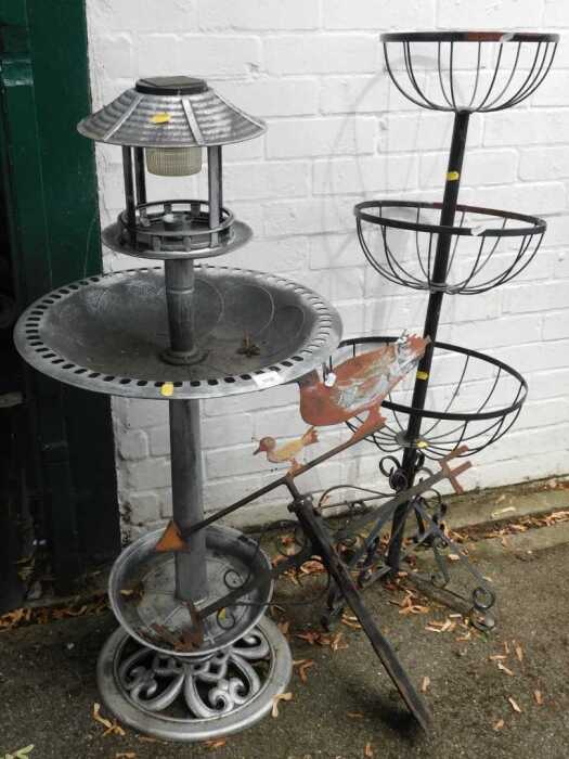 Garden metalwork, comprising a bird feeder, a plant stand, and a weather vane with ducks to top....