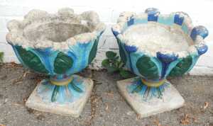 A pair of concrete garden planters, later painted.