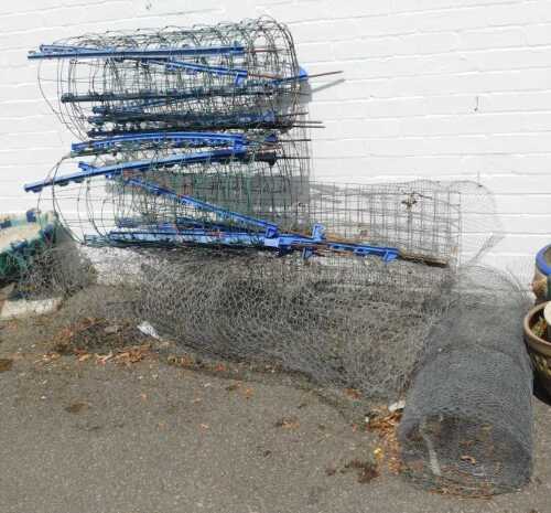 A large quantity of garden fencing, to include two rolls wire with plastic/metal stakes, 79.5cm...