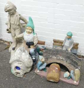 Garden statues, to include a large figure of a boy carrying a jug, garden gnome, a gentleman...