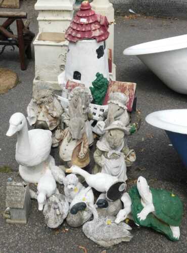 Garden statues, to include a large windmill, various animal figurines including ducks, geese, etc.