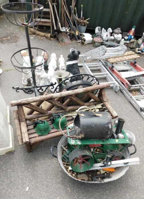 Garden effects, including a plant stand, a wall clock, various metal frames, a steam engine,...