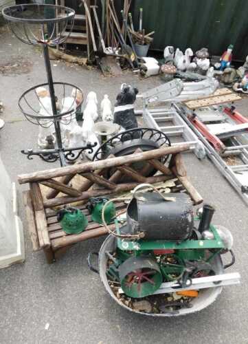 Garden effects, including a plant stand, a wall clock, various metal frames, a steam engine,...