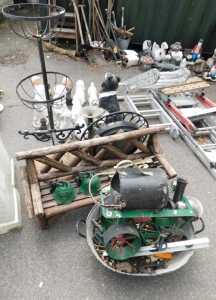 Garden effects, including a plant stand, a wall clock, various metal frames, a steam engine,...