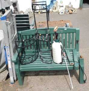 A green painted two seater garden bench, (AF), garden sprayers, two metal plant stands, a set of...