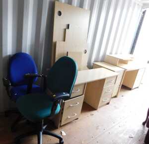 A suite of office furniture, comprising a six drawer knee hole desk, a desk with two tiers, a...