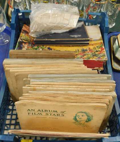 Cigarette cards and playing cards, to include John Players, WD & HO Wills, etc., contained...