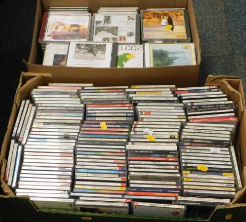 A large selection of CDs, contained within two boxes, mostly classical music.