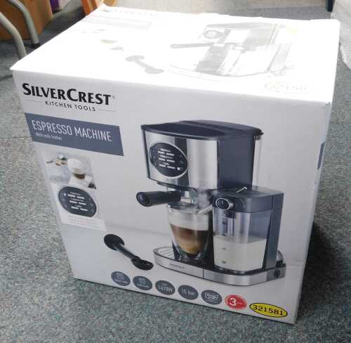 A boxed Silver Crest espresso machine.