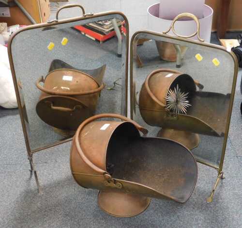 Two mirror inset fire screens, and a copper helmet shaped fire scuttle.