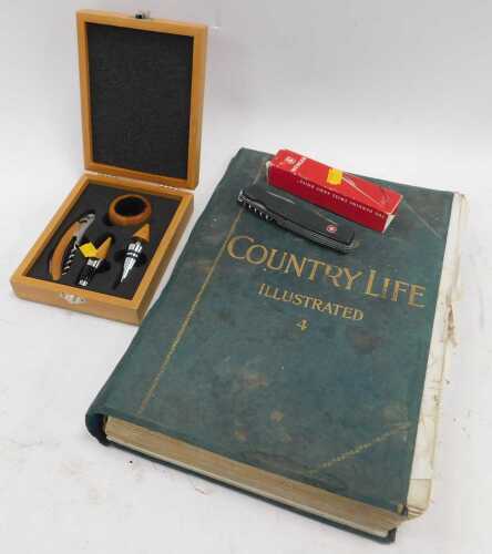 A cased corkscrew set, a Swiss knife, in box, and a large book containing Country Life...