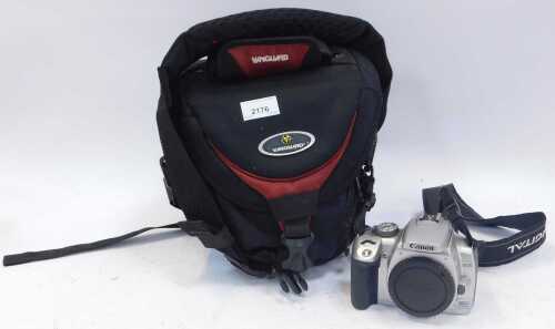 A Vanguard camera bag, containing a Canon digital EOS camera, with leads. (1 shelf)