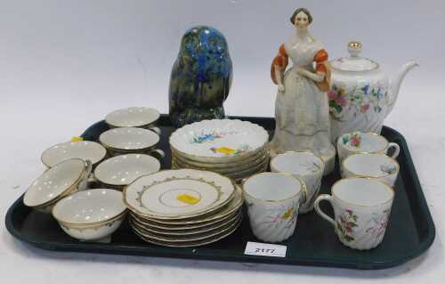 Ceramics, comprising a large figure of a lady, a teapot with lid, teacups, saucers, side plates,...