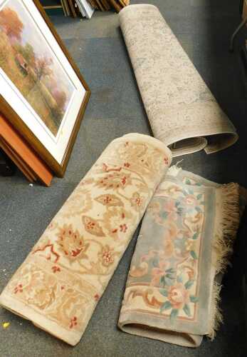 Three machine made rugs.