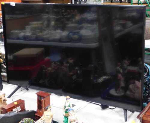 A Samsung 43" television, model number UE43TU77020K, with lead.