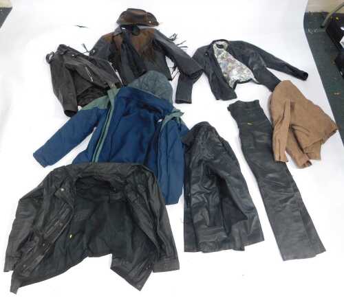 A quantity of leather jackets, to include an example with fringing, motorbike type jackets, etc....