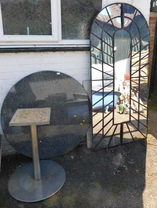 A granite topped circular garden table, with white metal finish base, and a large garden mirror....