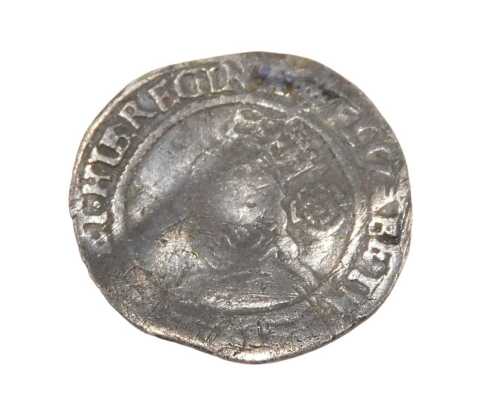 Coins. An Elizabeth I threepenny bit, probably 1568.