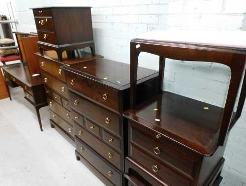 A comprehensive Stag bedroom suite, comprising two compactum chests, three bedside cabinets,...