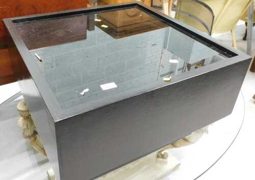 A retro side or coffee table in black, with glazed top.