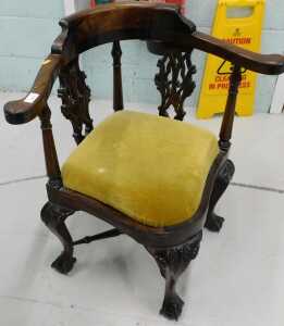 A George III style Chippendale design mahogany corner chair, with shaped seat and heavily carved...
